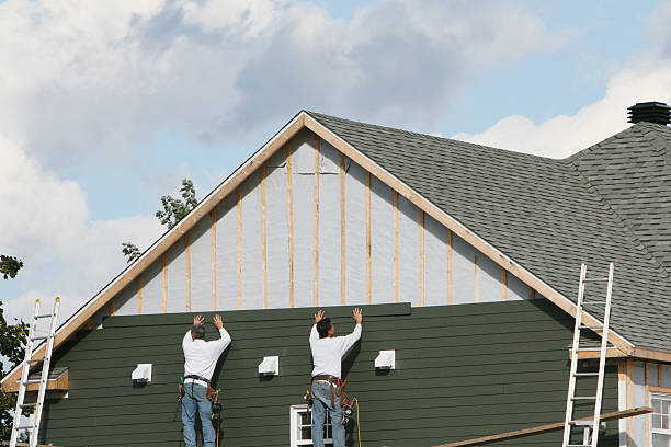 Professional Siding Contractor technician working in Windsor, CO
